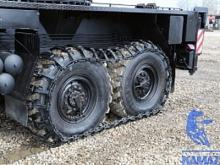 Как увеличить проходимость 'КАМАЗа'? Надеть на него гусеницы