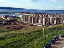 Как застроить косогор у поселка 'Чаллы яр'? Можно ли строить жилье без школ и детсадов?